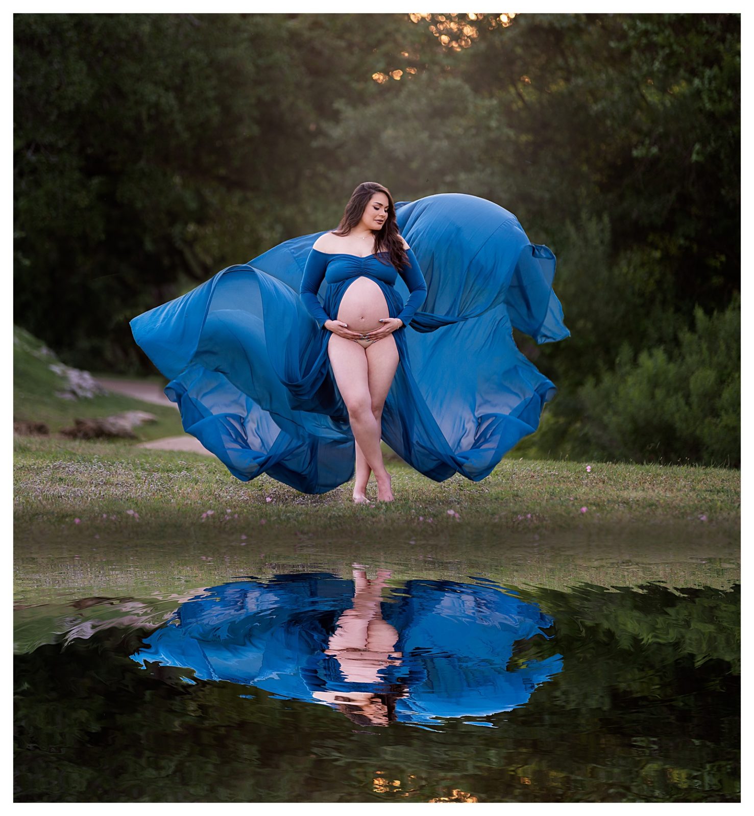 A pregnant woman wearing a teal flowing maternity dress for an artistic photoshoot in Austin, Texas.