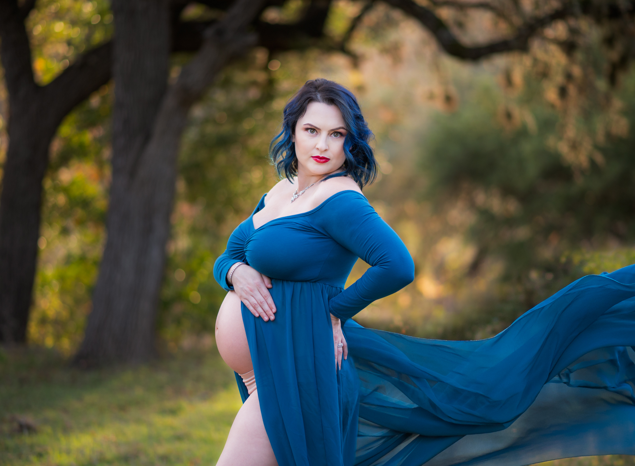 Maternity photos with a turquoise flowy dress