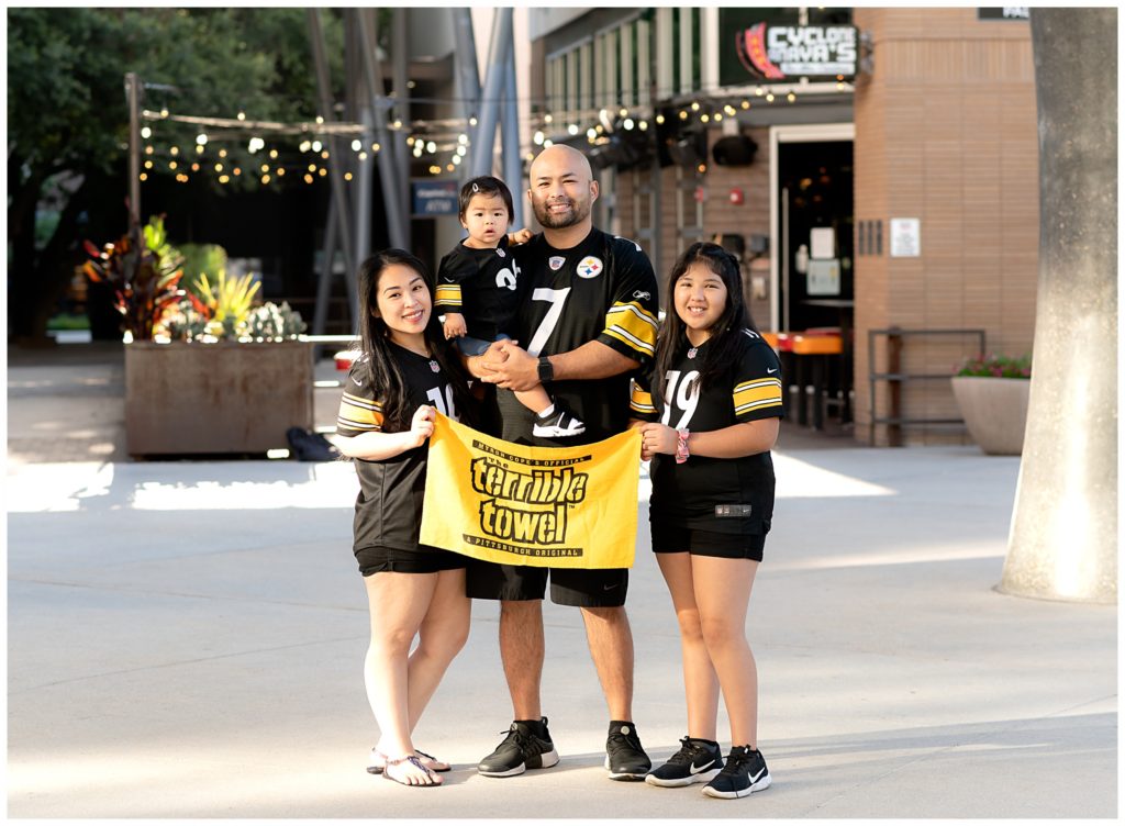 Family photo of Steeler's fans at the Domain in Austin, TX