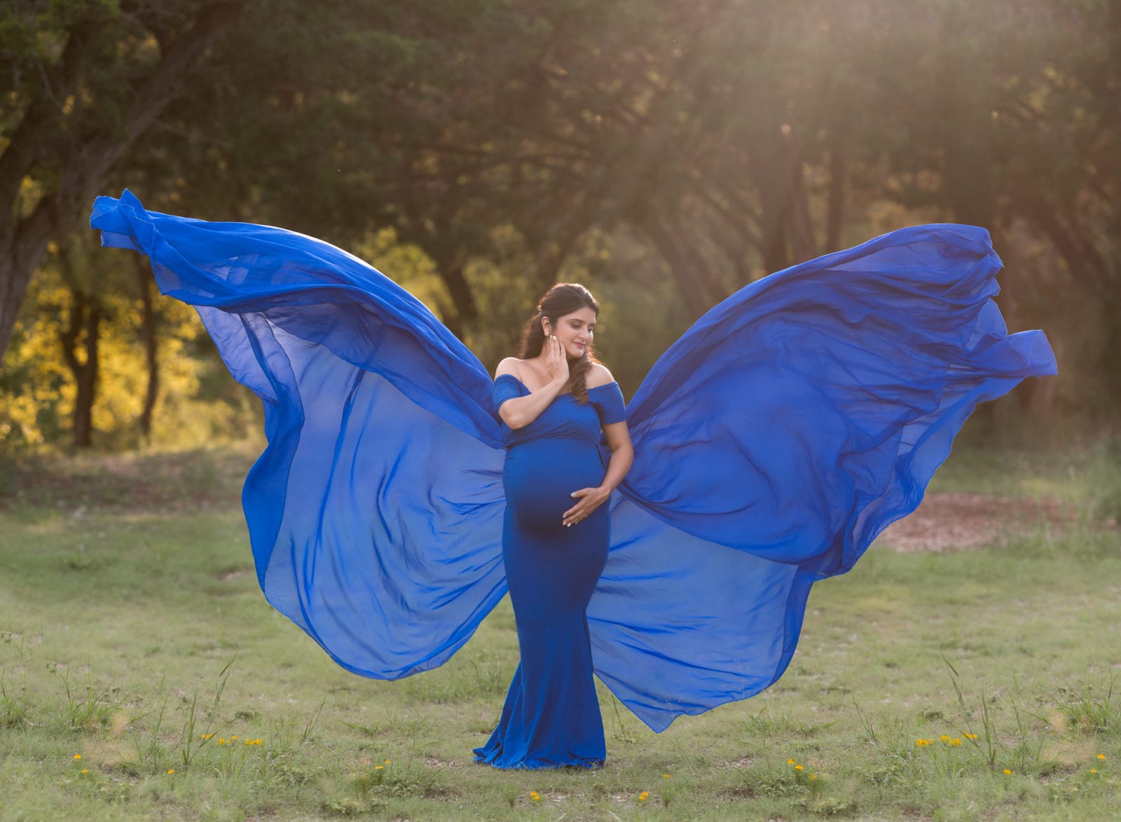 A pregnant woman captured as a butterfly.