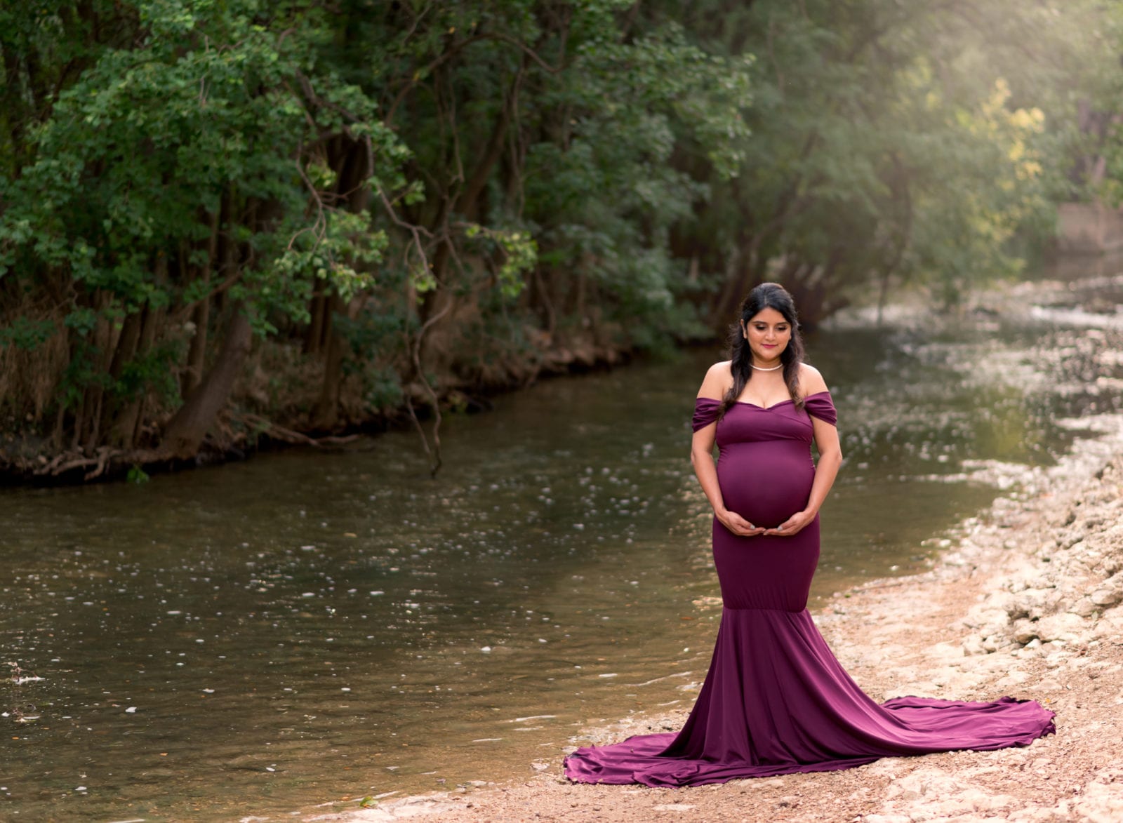Maternity Portrait in a purple dress. 