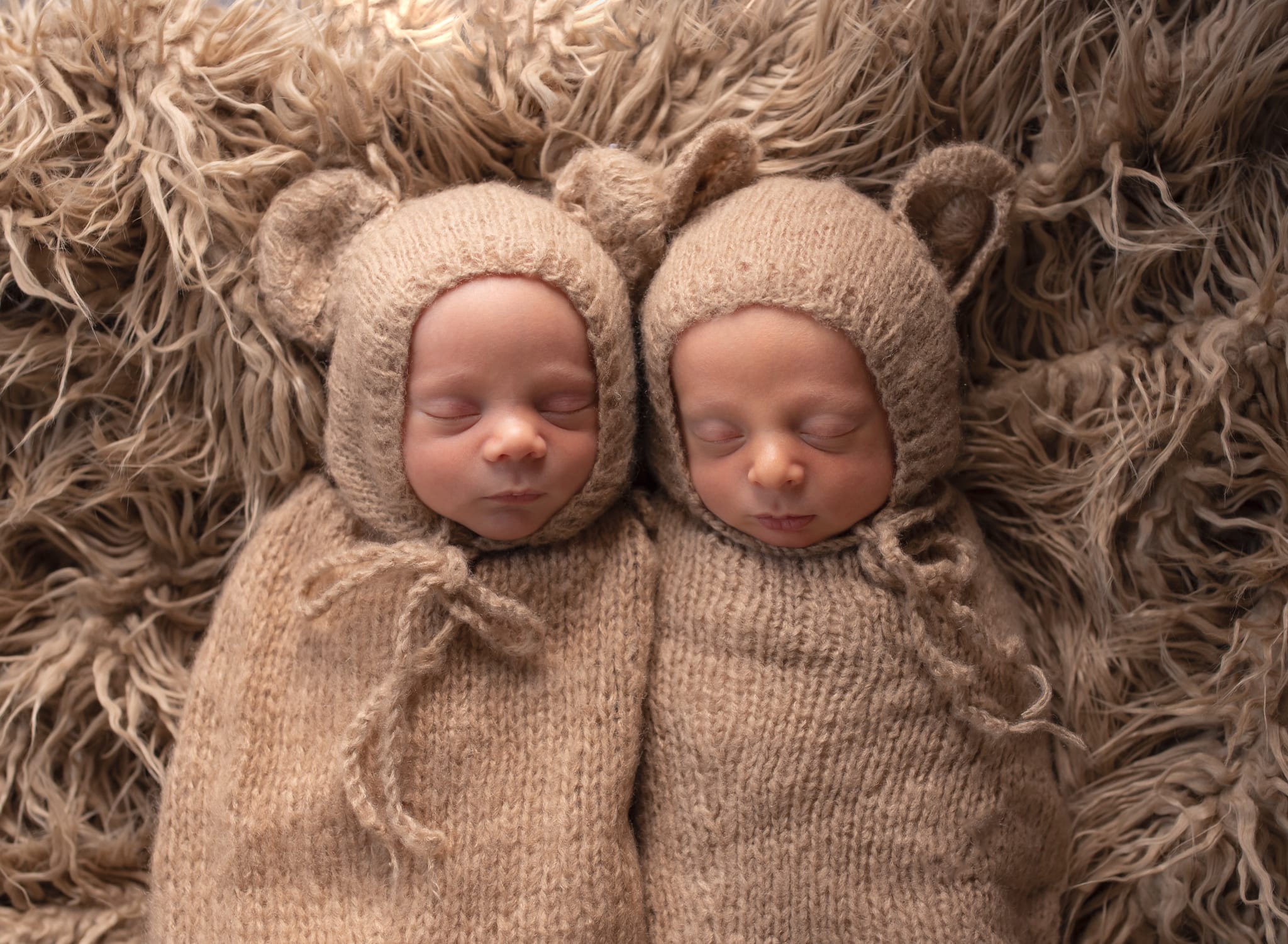newborn twins dressed as bears