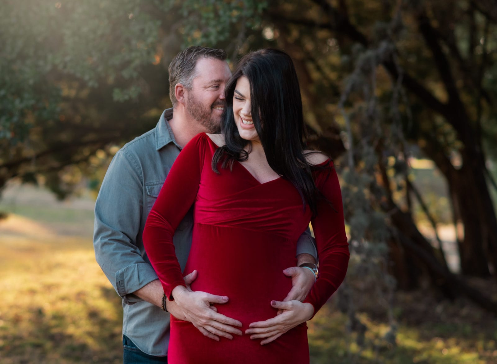 A happy couple during their maternity photoshoot in Austin.