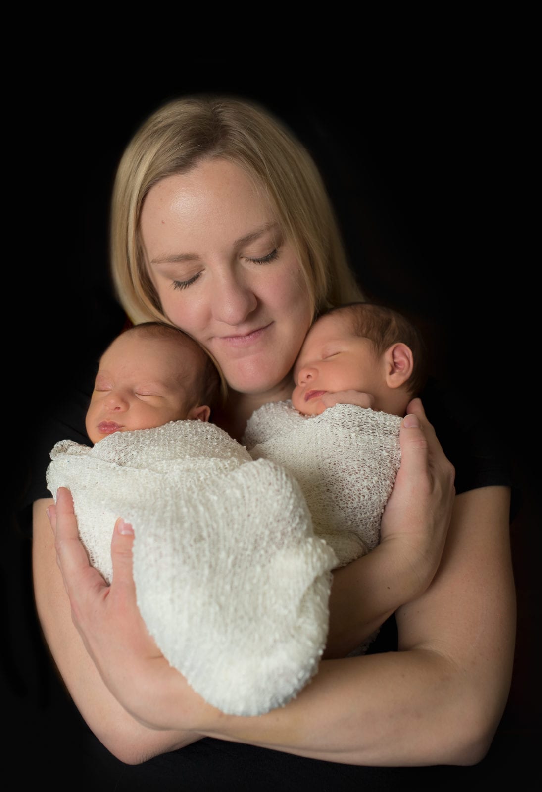 newborn twins with mom