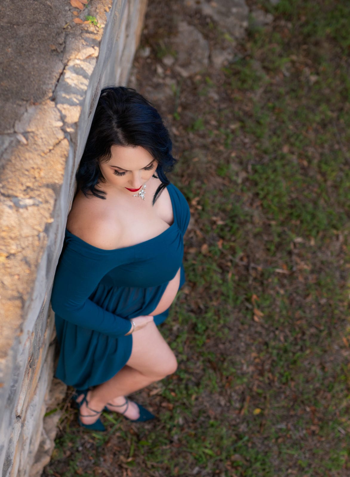 Maternity portrait in a teal dress.