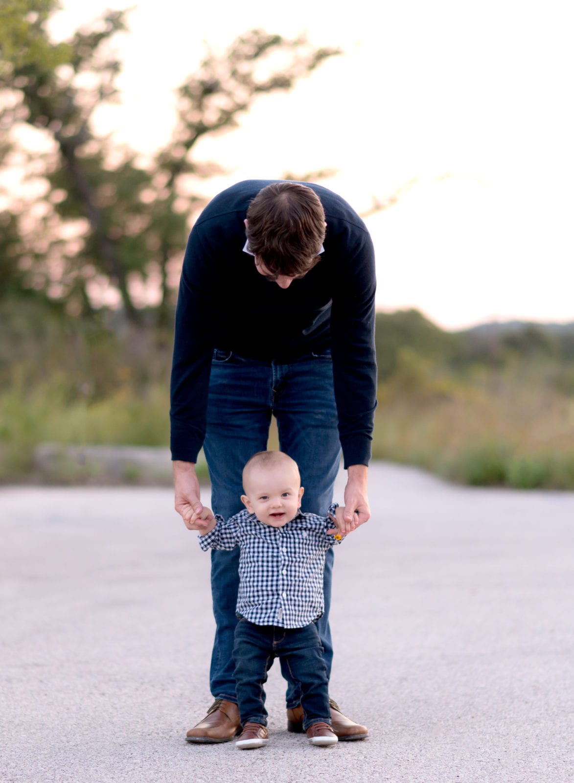 father with young son walking