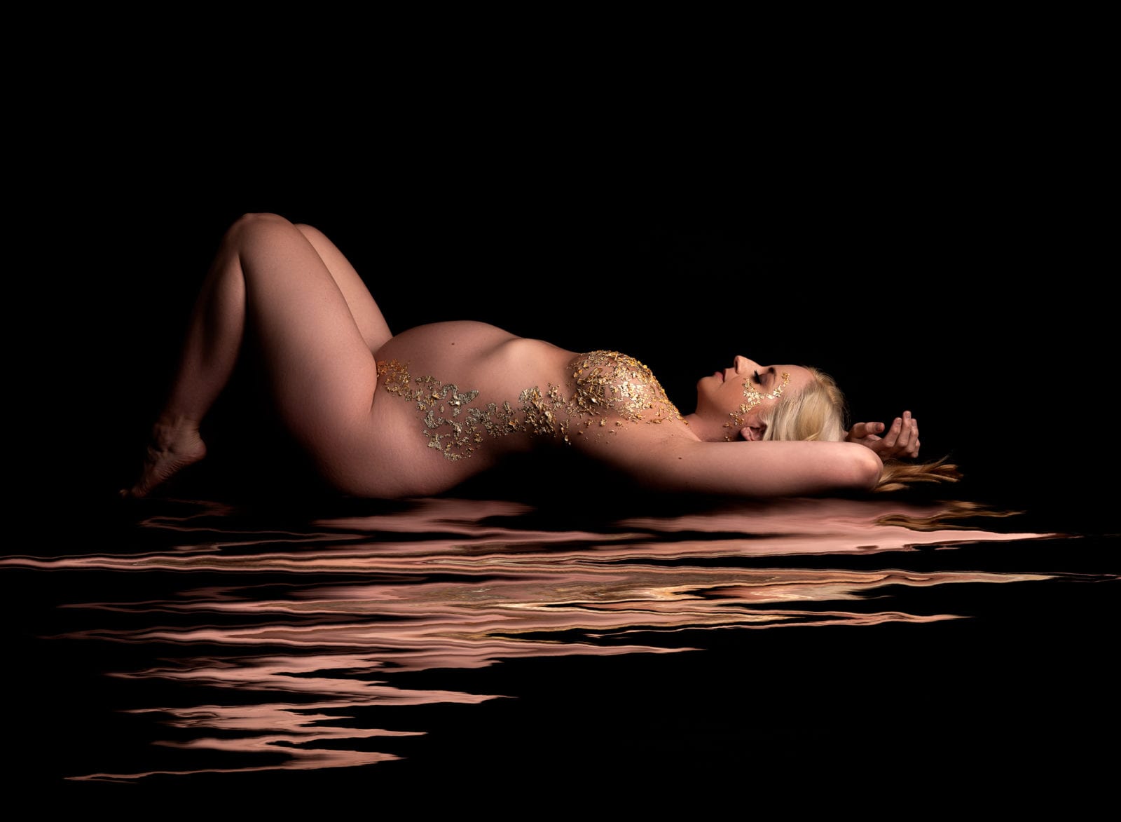 Gold glitter maternity photo in water by Hello Photography