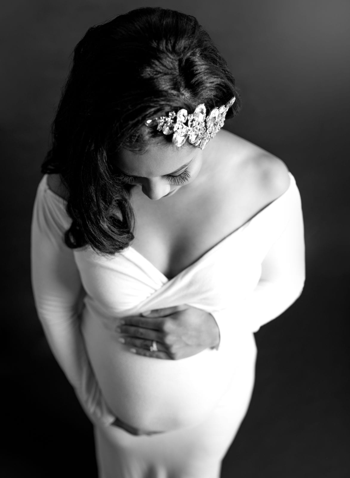 black and white photo of a glamorous pregnant woman