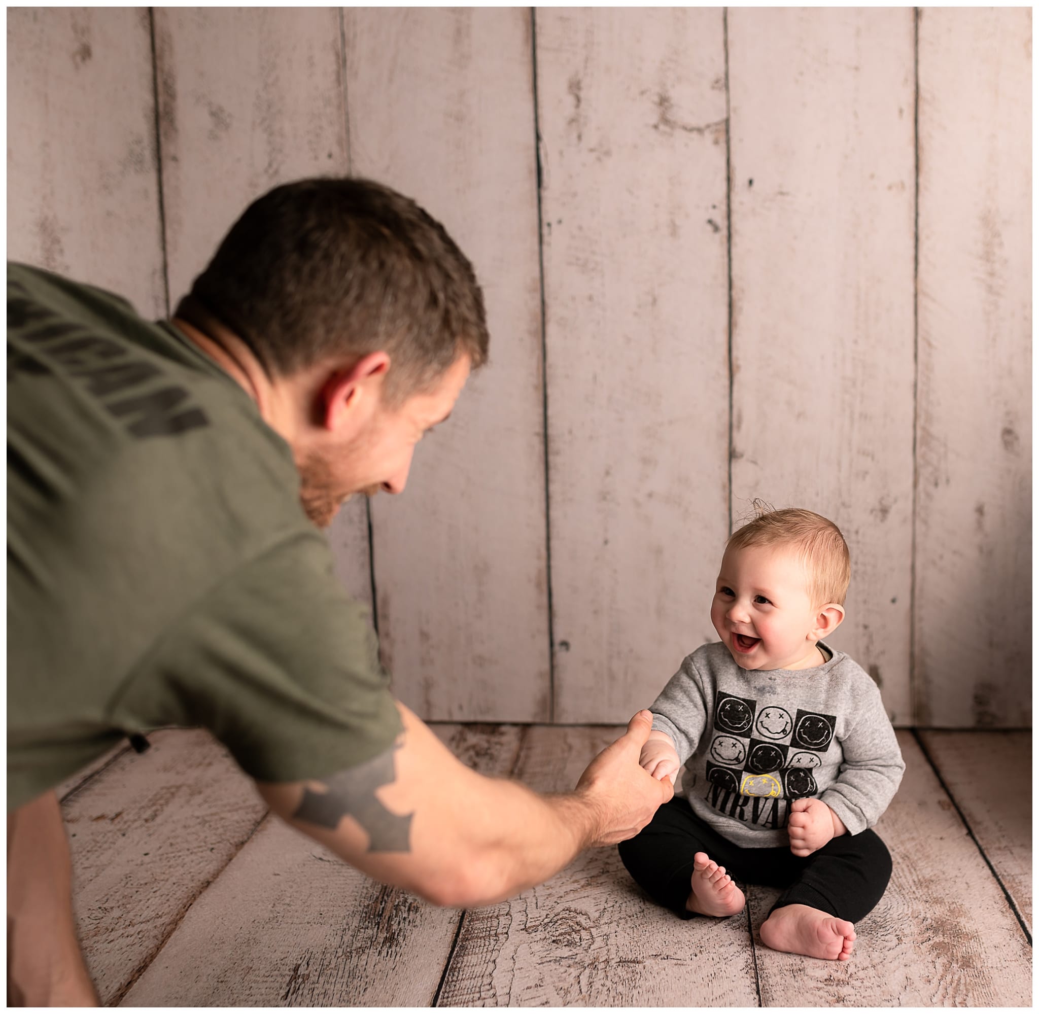 dad with his smiley baby