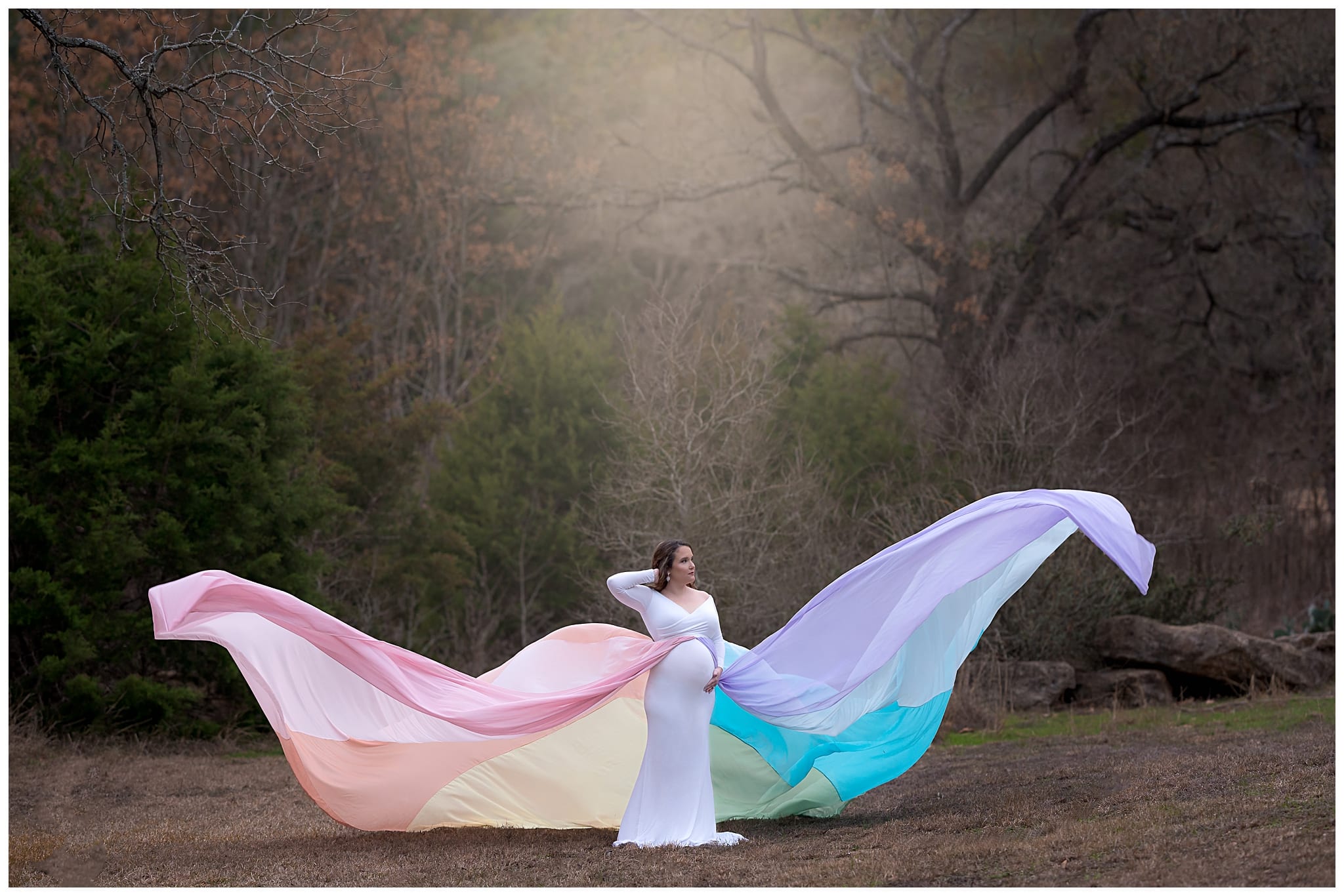 maternity photo in a rainbow dress