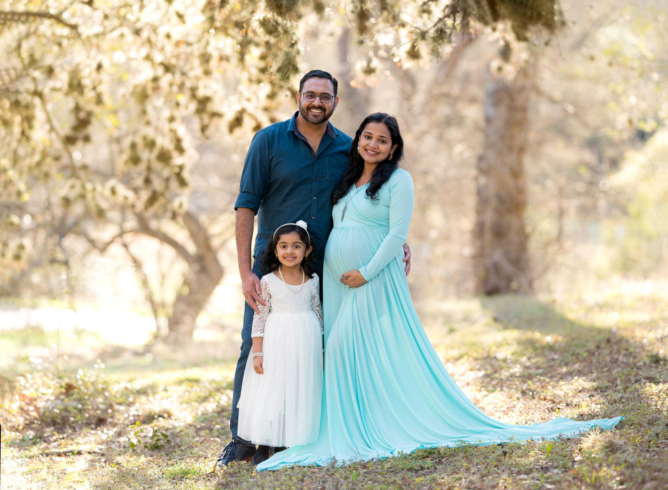 A family of 3 for an outdoor maternity photoshoot