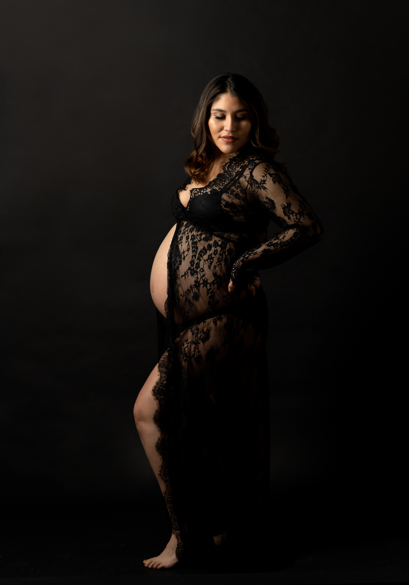 studio maternity photo in black lace dress