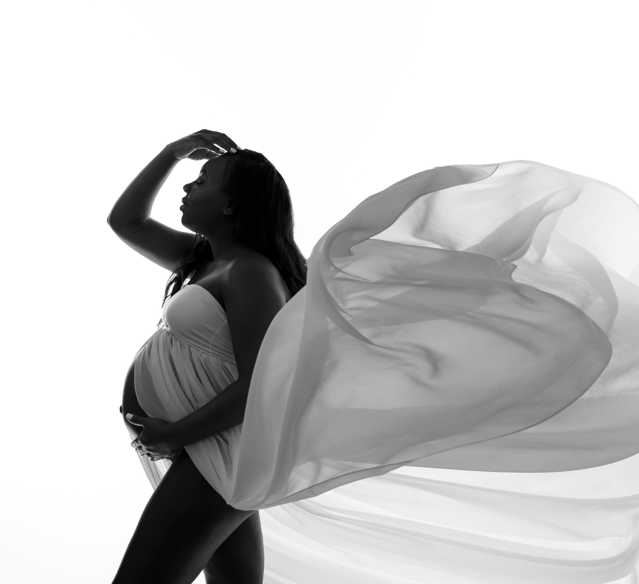 black and white maternity photo with a flowy dress