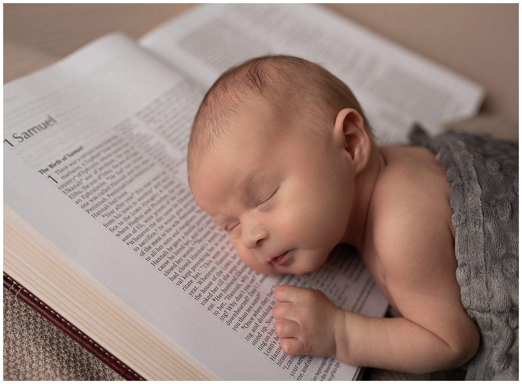 newborn baby sleeping on a bible