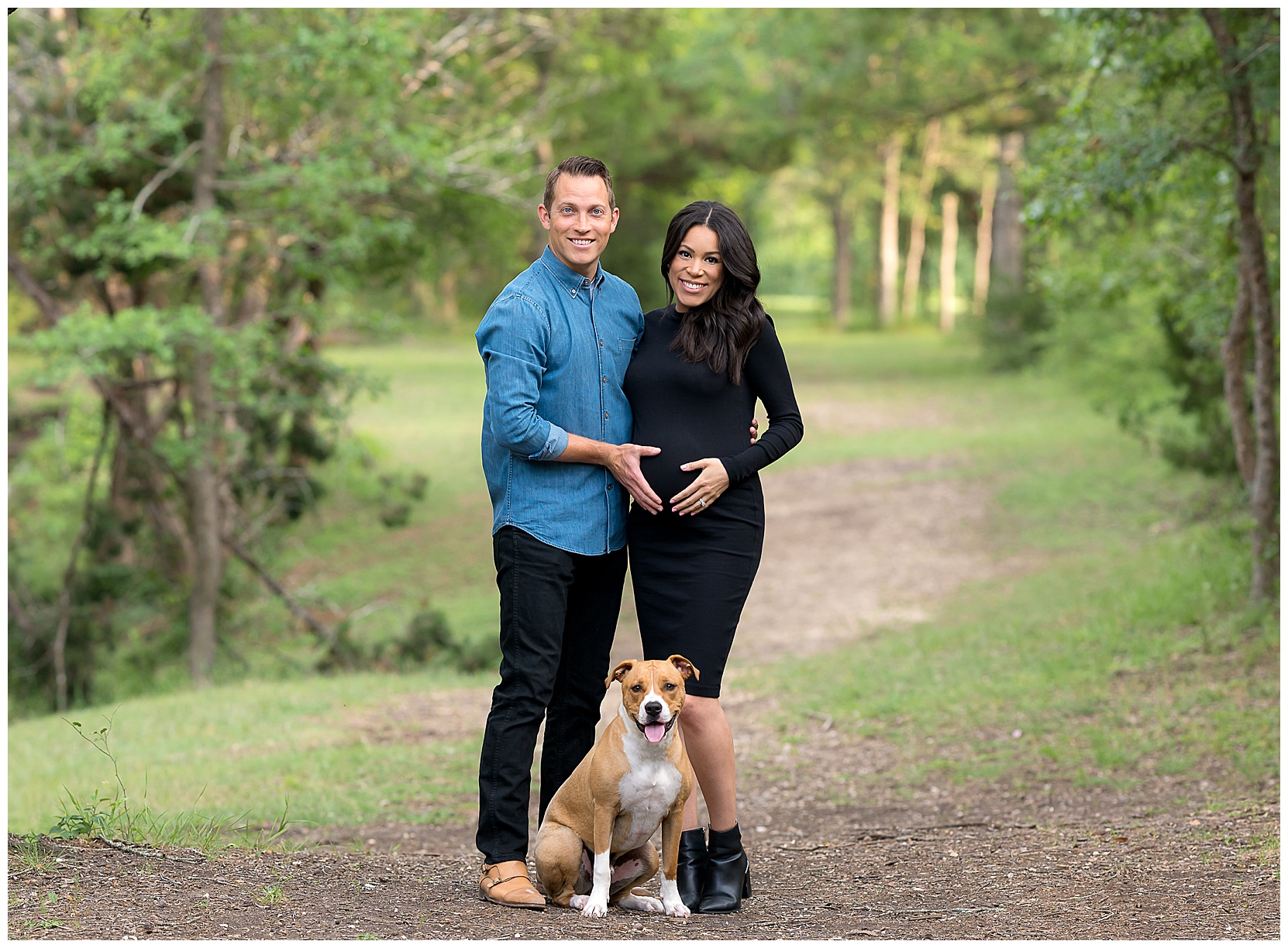 Maternity photo of a couple with their dog