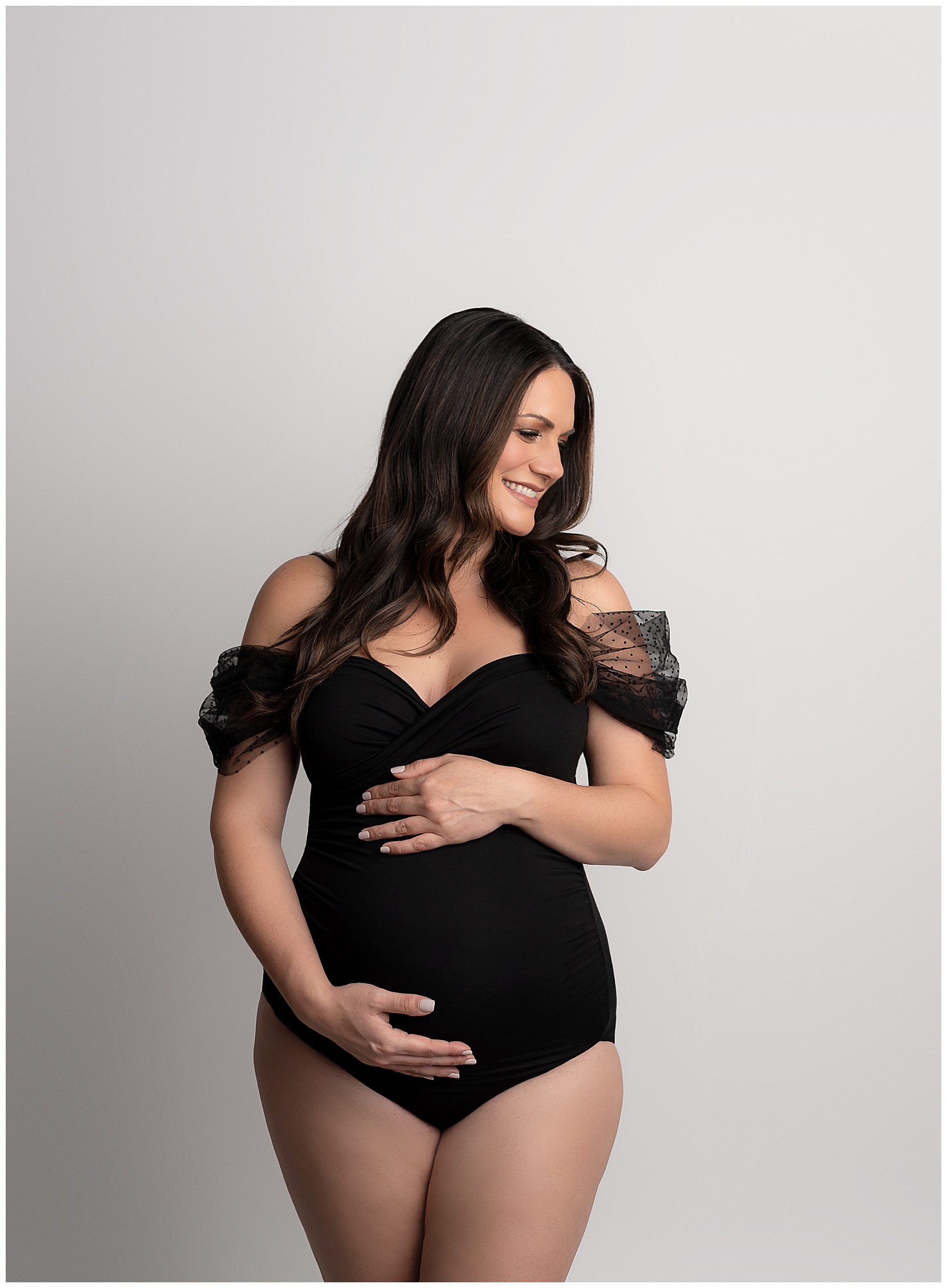 pregnant woman black body suit