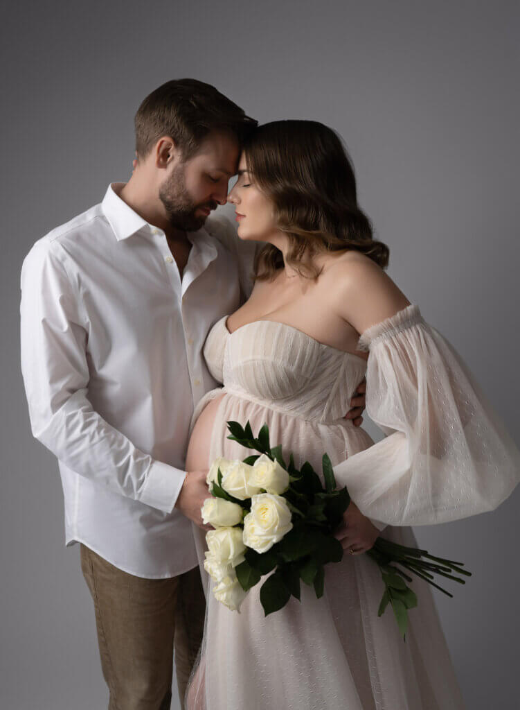 Leander maternity photographer couple studio session with romantic lighting and white dress
