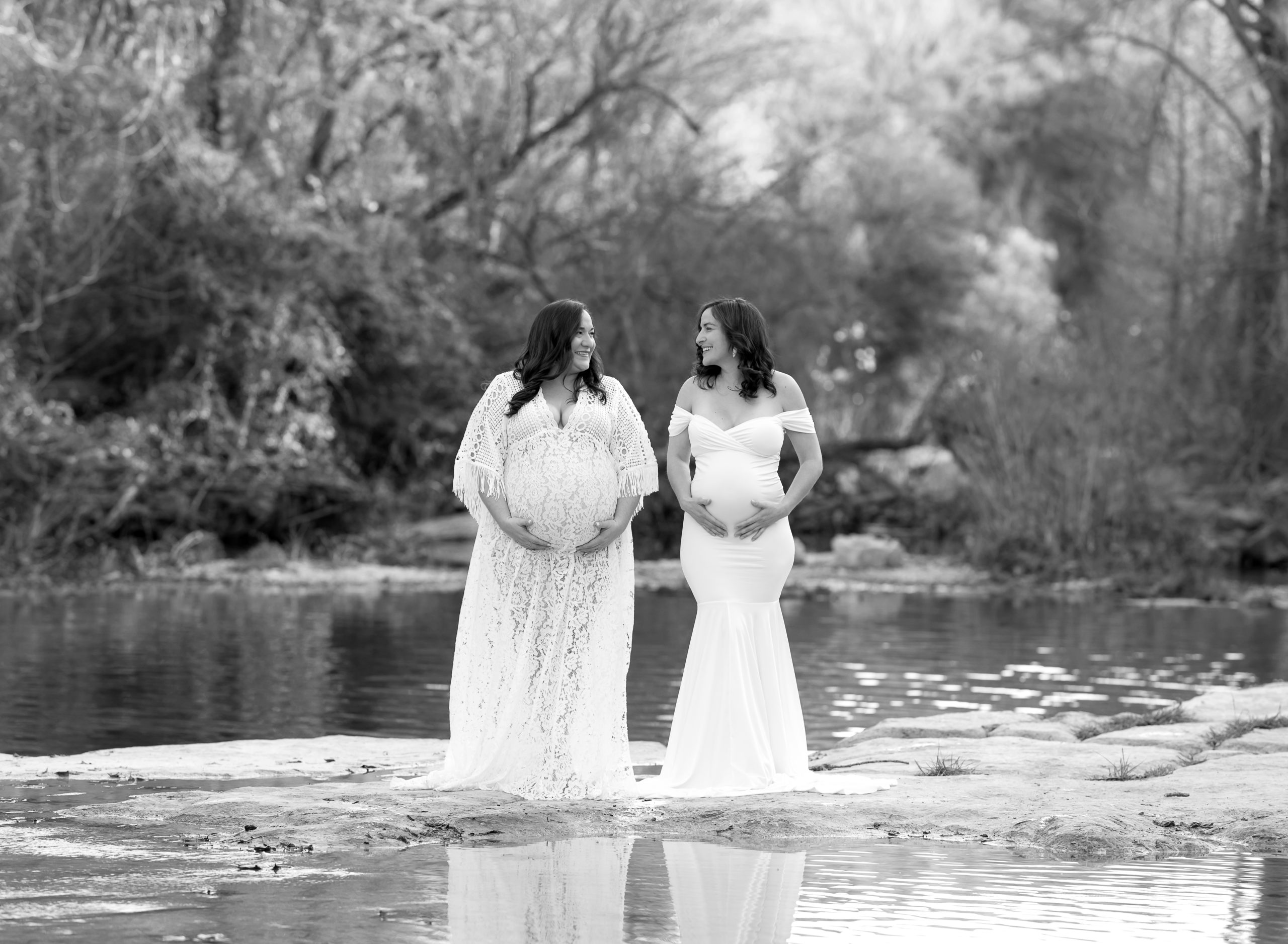 pregnant sisters white dresses water