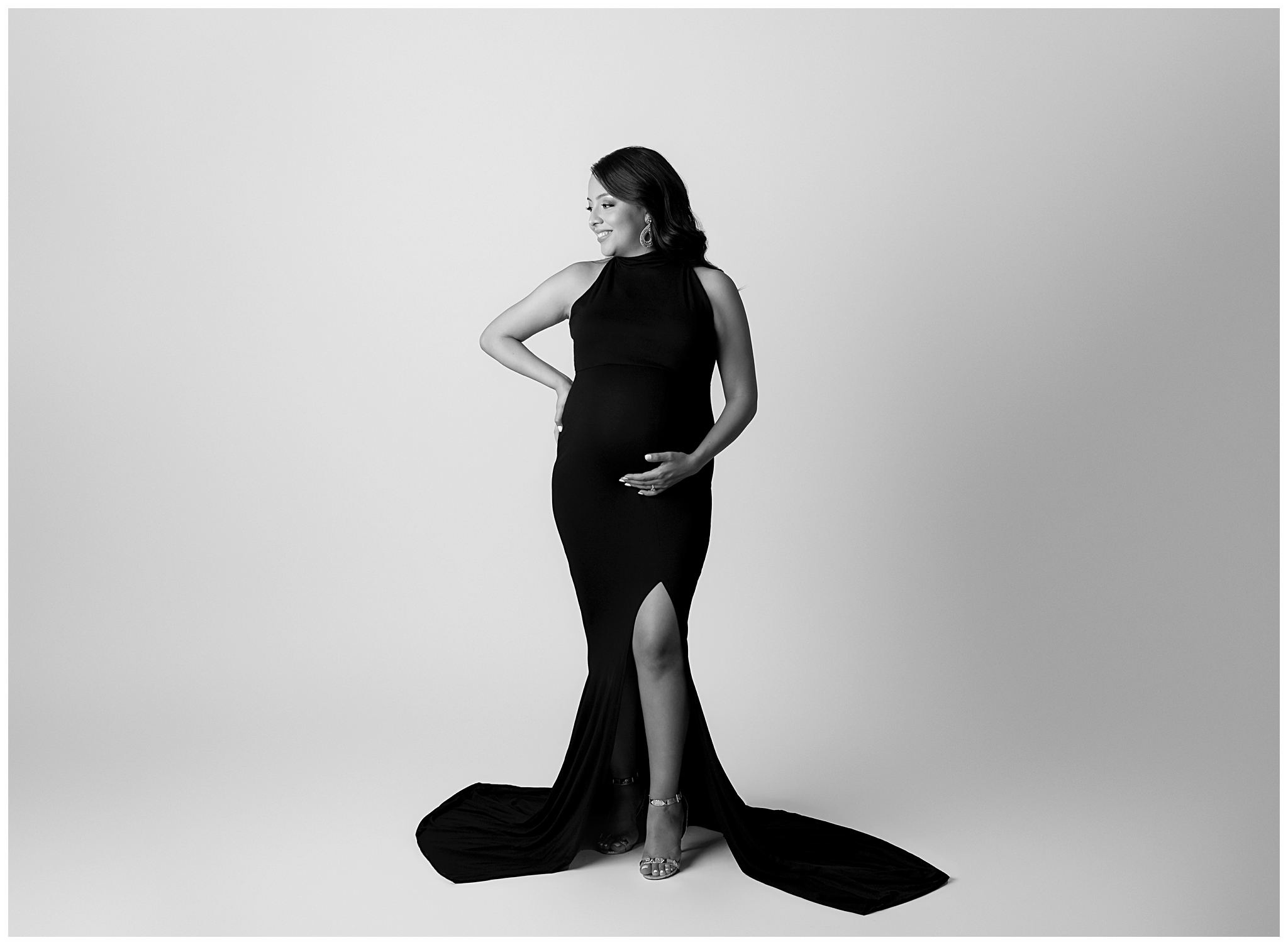 pregnant woman black dress with leg slit