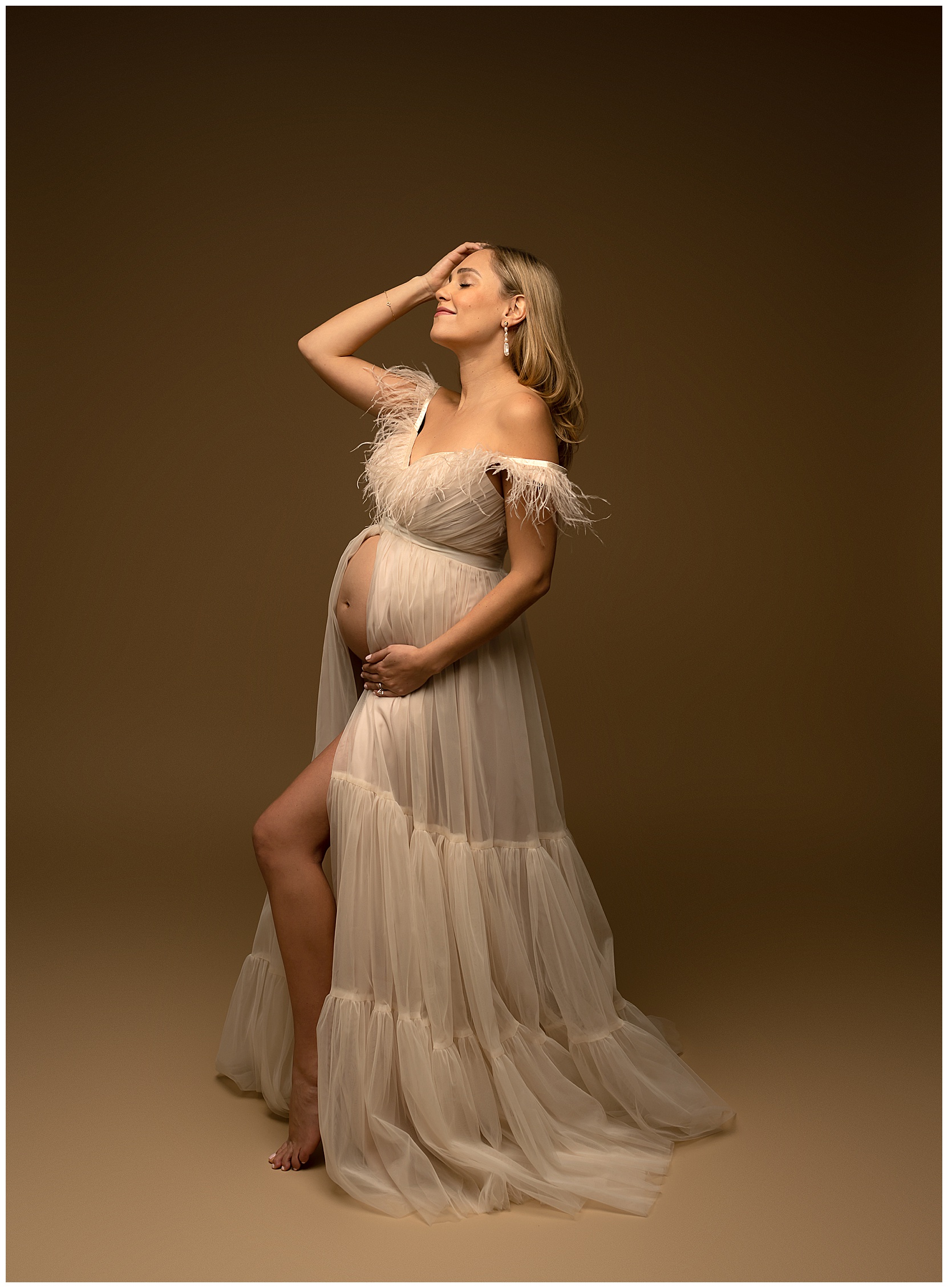 Cedar park maternity photo with a pregnant woman in a tulle dress with an open belly