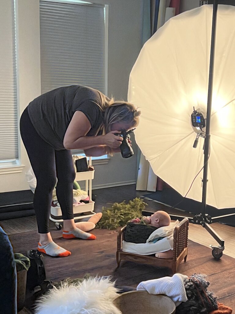 Fall newborn photography setup Austin studio showing seasonal props and professional equipment