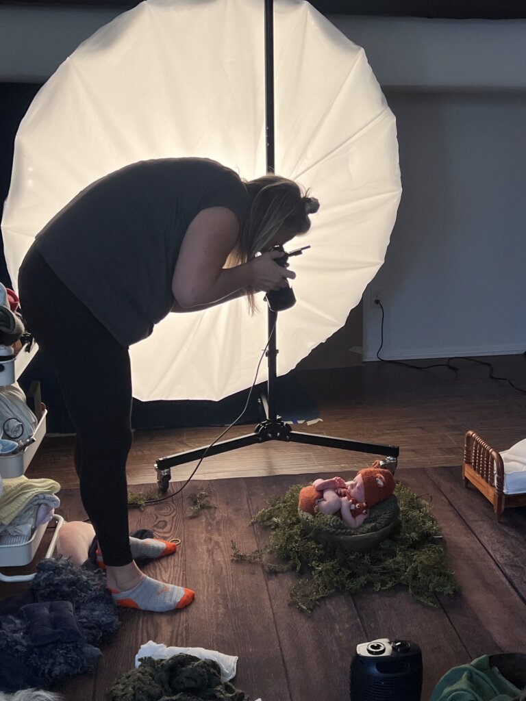 Behind the scenes fall newborn photography session in Austin studio with professional lighting setup