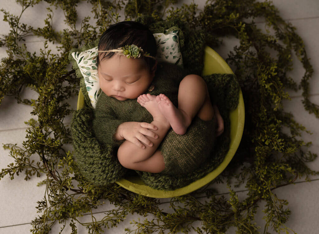 Organic newborn photography Austin studio featuring eucalyptus and natural styling elements