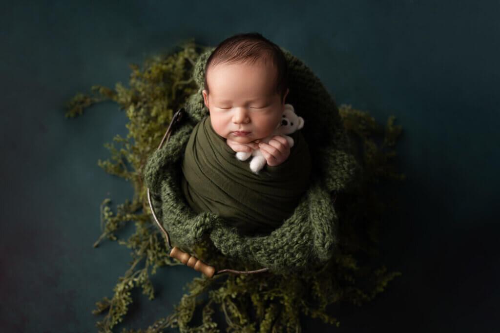 Best time for newborn photos Austin featuring perfectly posed sleeping newborn