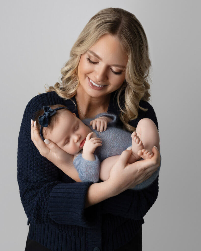 Best time for newborn photos Cedar Park featuring perfectly posed sleeping newborn