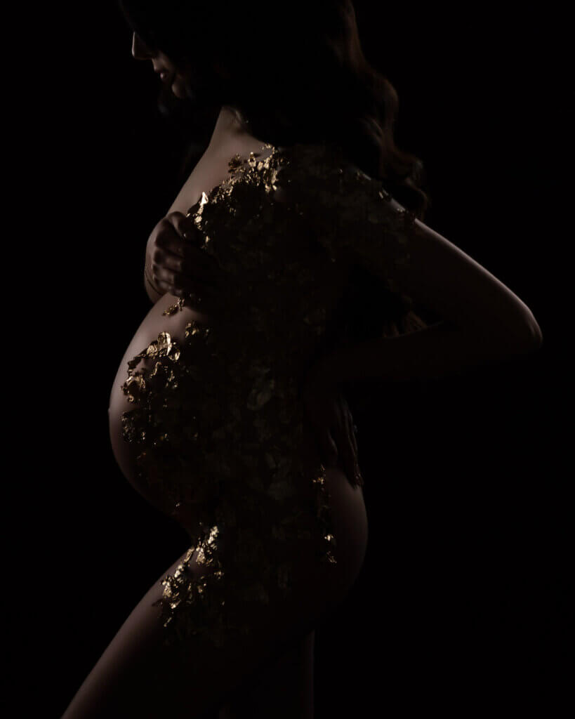 elegant gold glitter boudoir maternity portrait by Austin pregnancy photographer