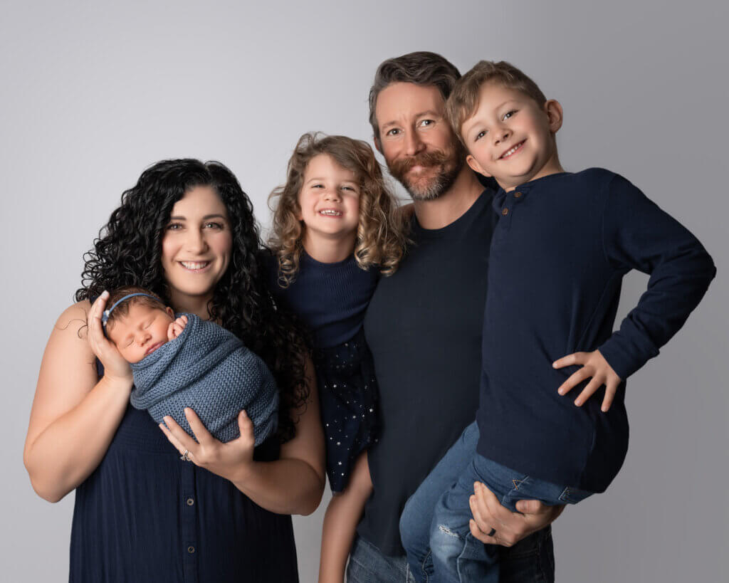 family of 5 with newborn baby during austin newborn photoshoot