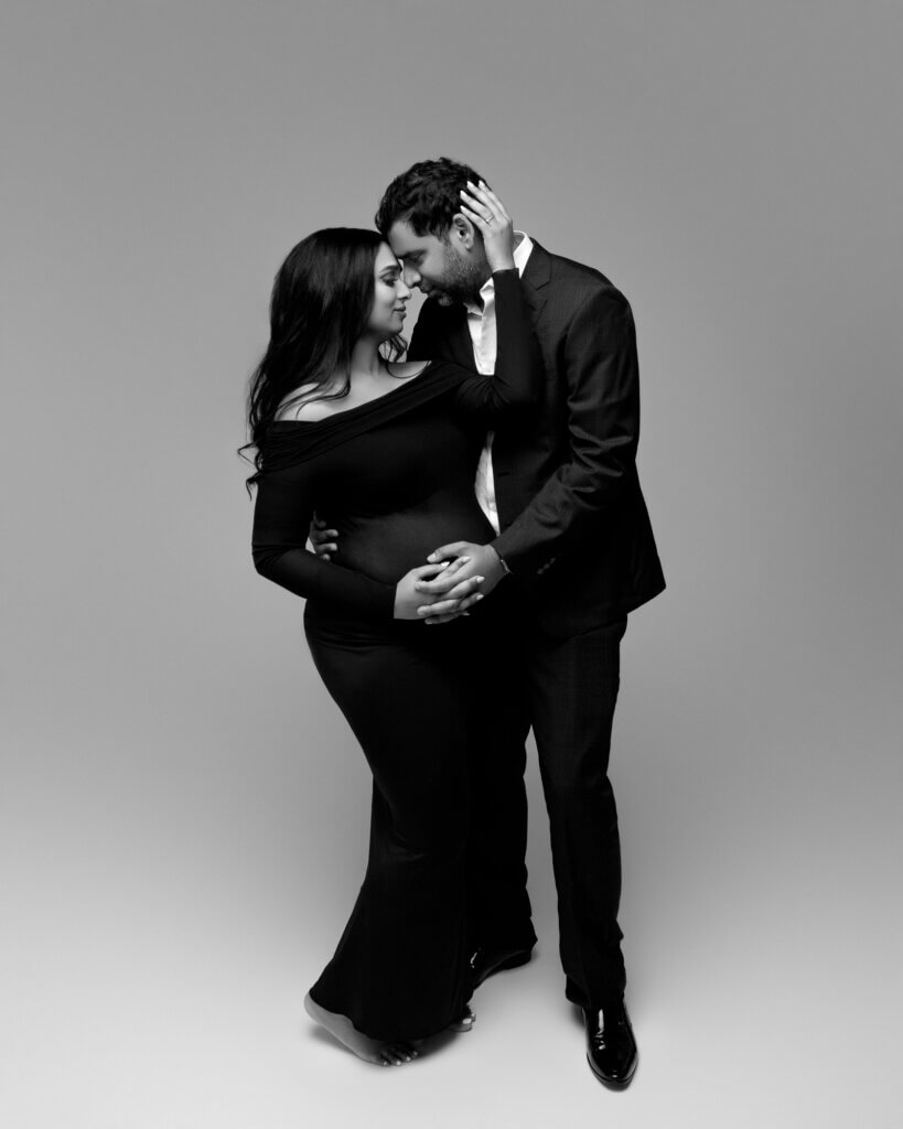 romantic editorial maternity photo with couple embracing