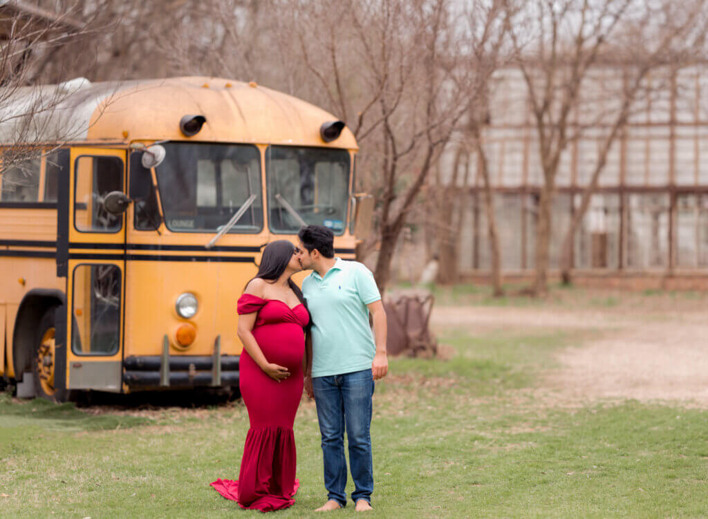 maternity photoshoot vintage school bus Sekrit Theater Austin Texas red gown